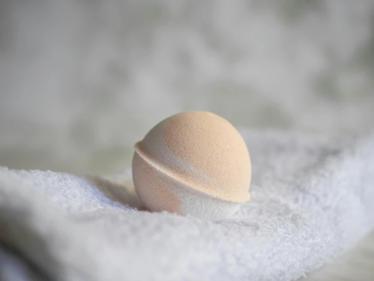 an egg on a bed with snow all around it