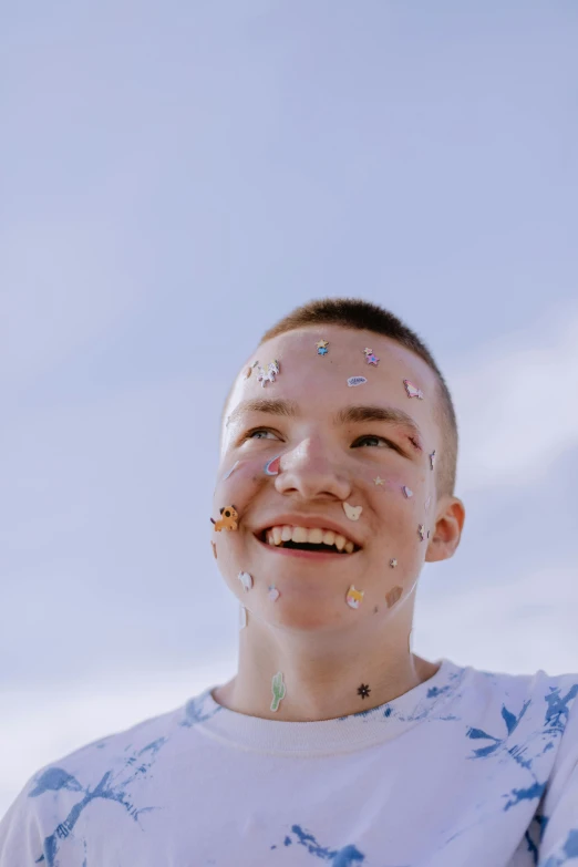 a person wearing many sprinkles all over his face