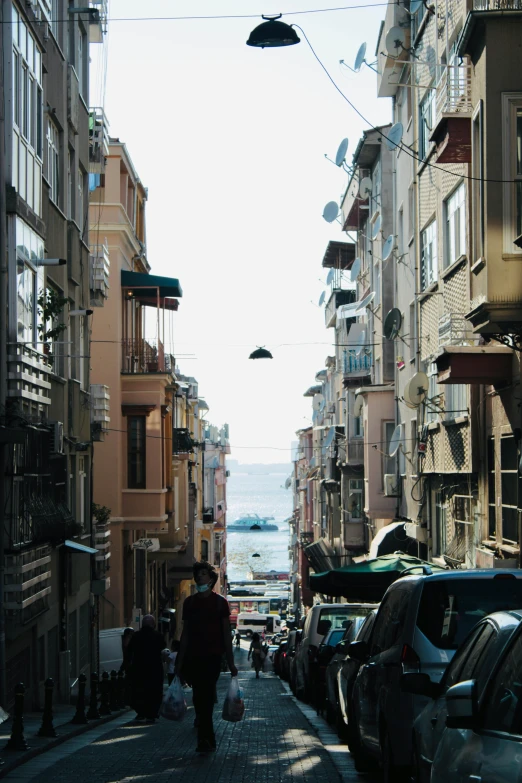 an old city street is crowded with cars