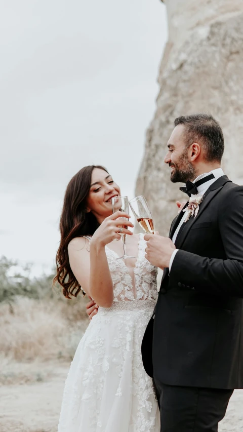 a man and a woman are standing outside