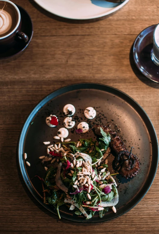 a plate of food with mushrooms is on a table