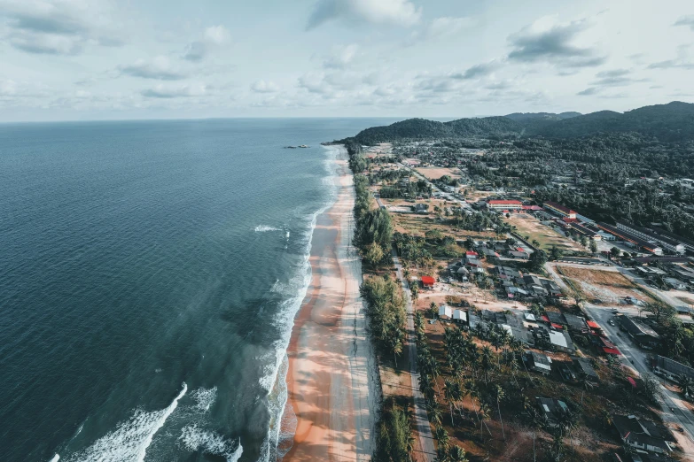 an aerial view of an ocean with houses and buildings