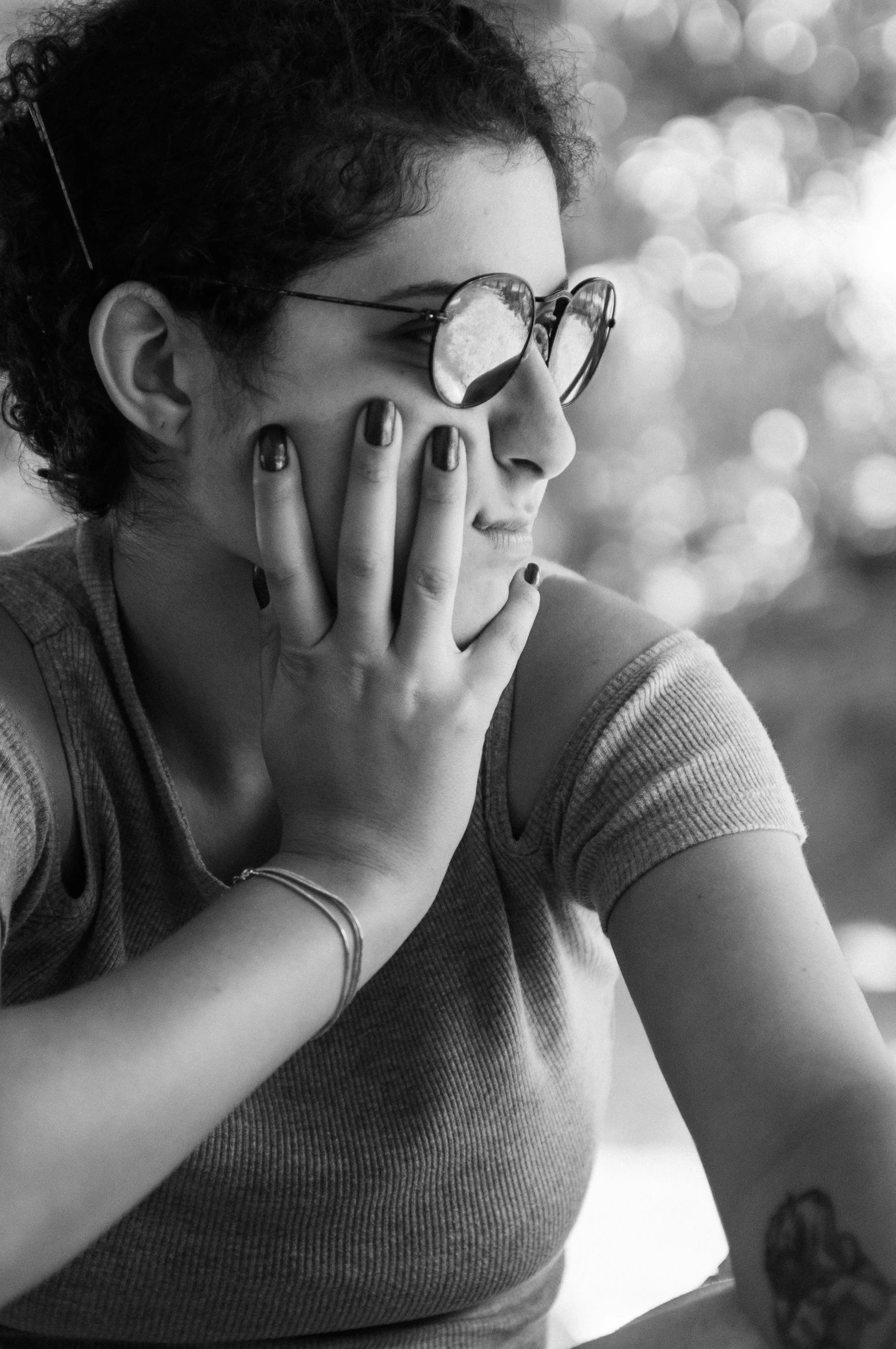 a black and white po of a woman in glasses