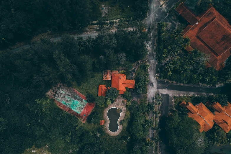 an aerial po shows a house and trees in the background
