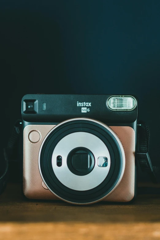 an analog camera is on top of the table