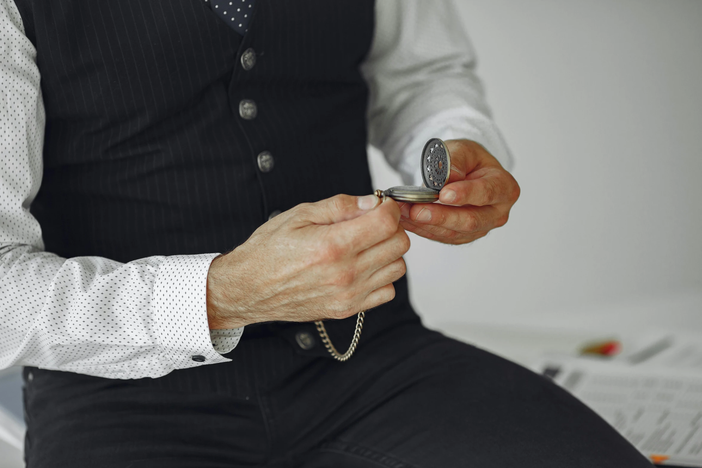 a man is using his cell phone wearing a necktie