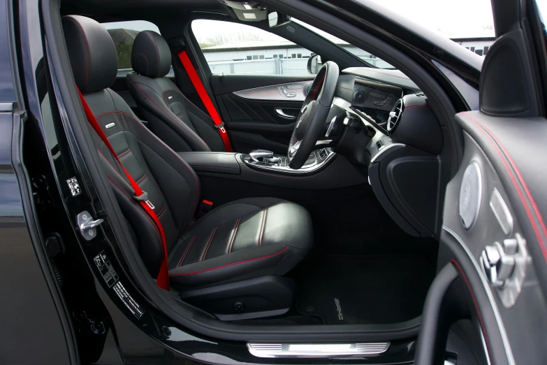 the front seats of a vehicle in a parking lot