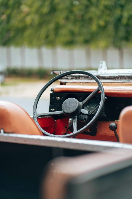 a red car interior with steering wheel and dashboard