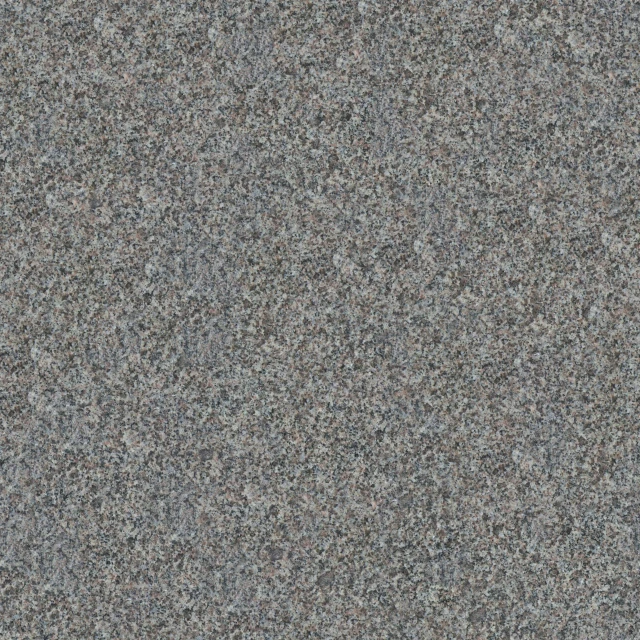 a grey gray surface with black speckles is shown