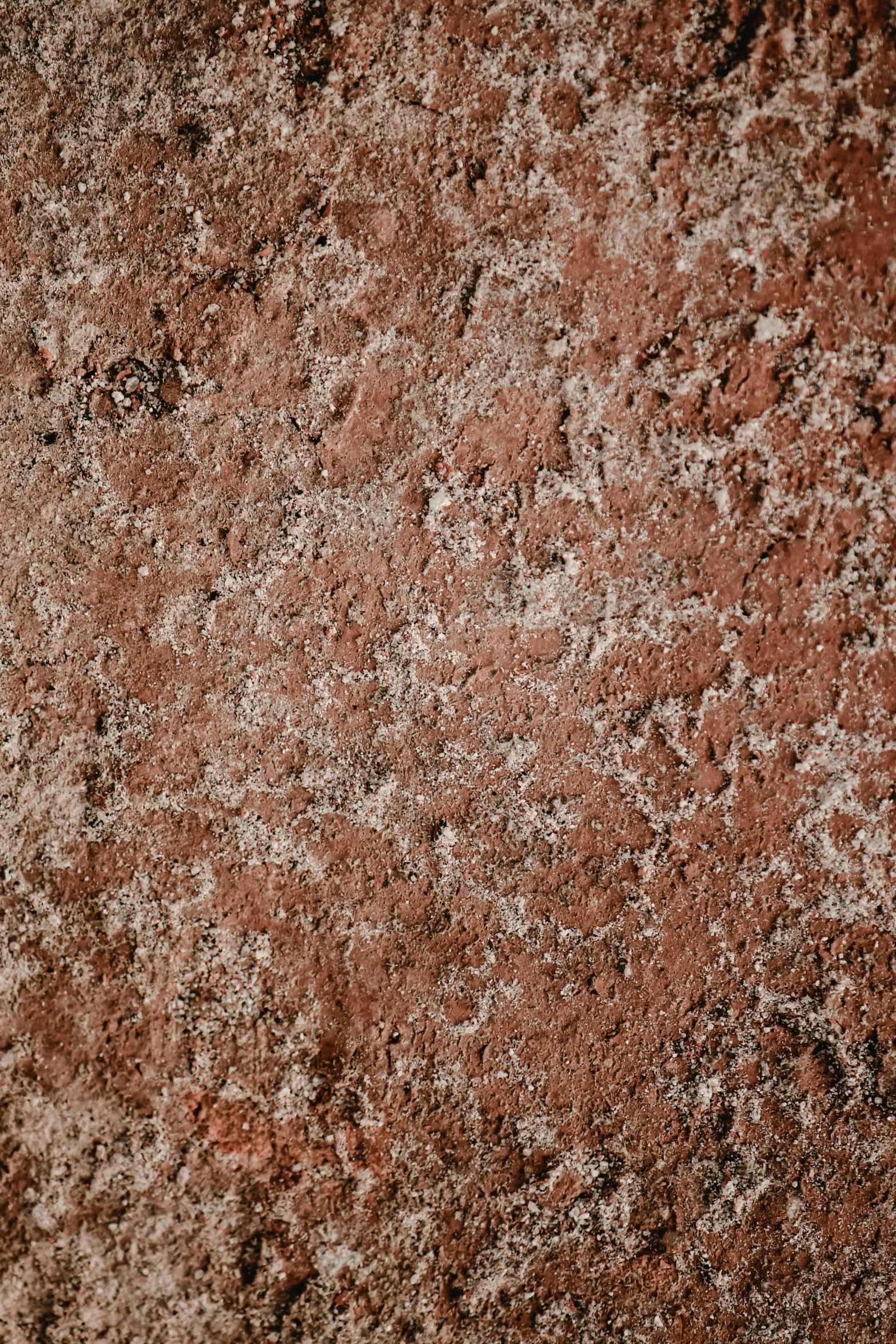 close up of red stone, brown and white color scheme