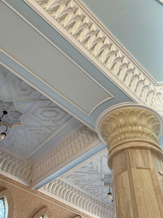 columns and painted ceiling, ornately decorated, stand in the middle of a room