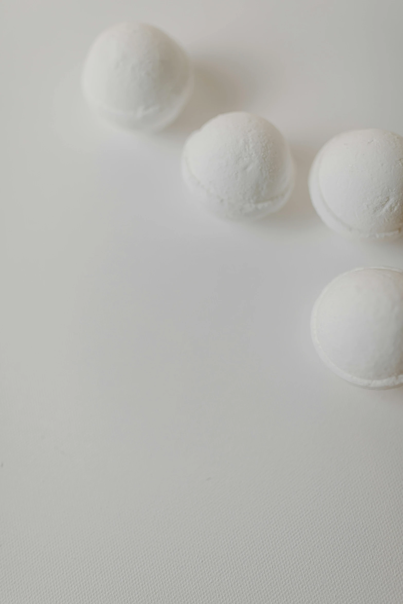 three small round balls sit on top of a table