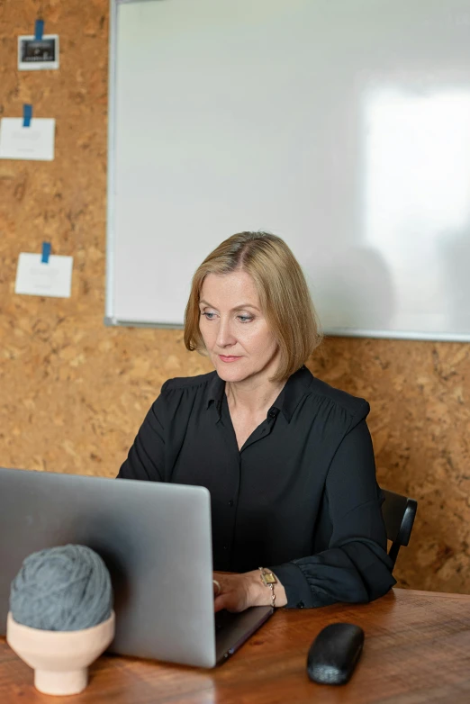 an image of a woman at a desk