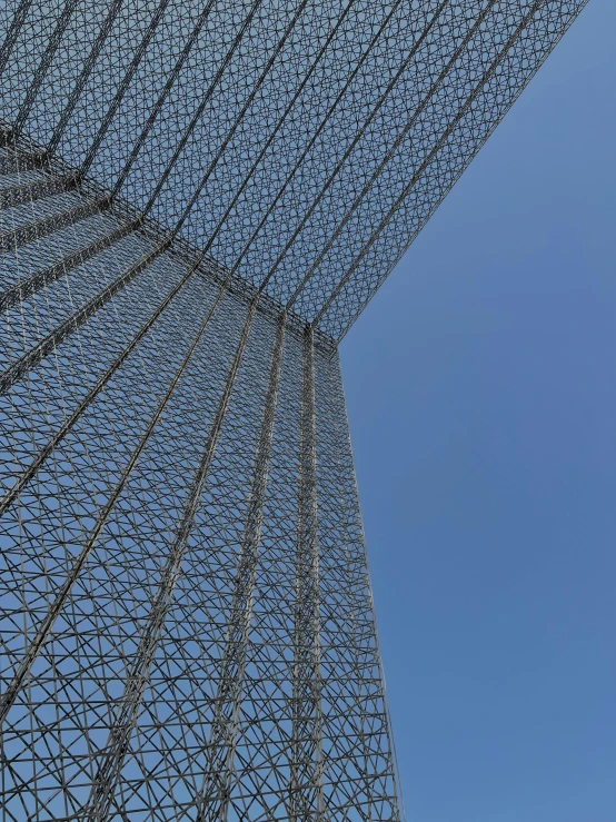 a plane is flying over an interesting structure