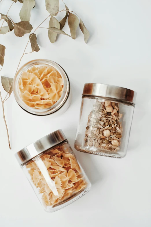 jars with nuts and other items in them on a table