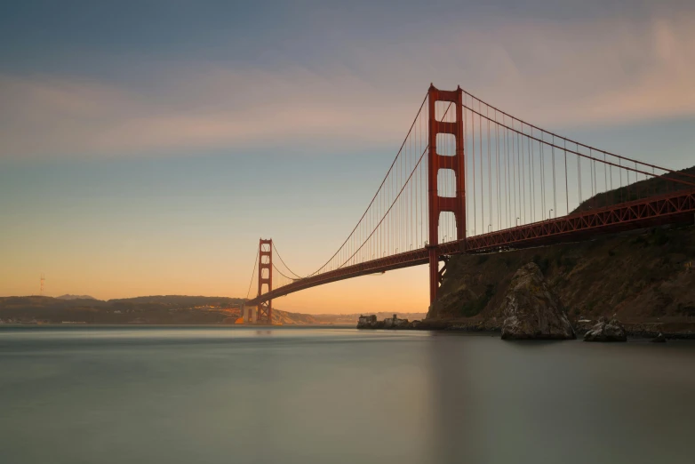 an image of the golden gate bridge during sunset
