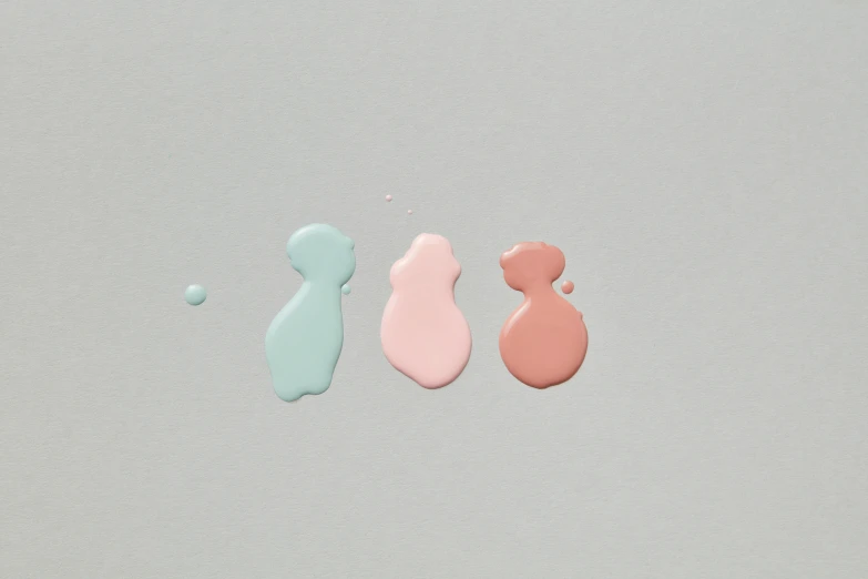 three different shaped candy with some pink and green