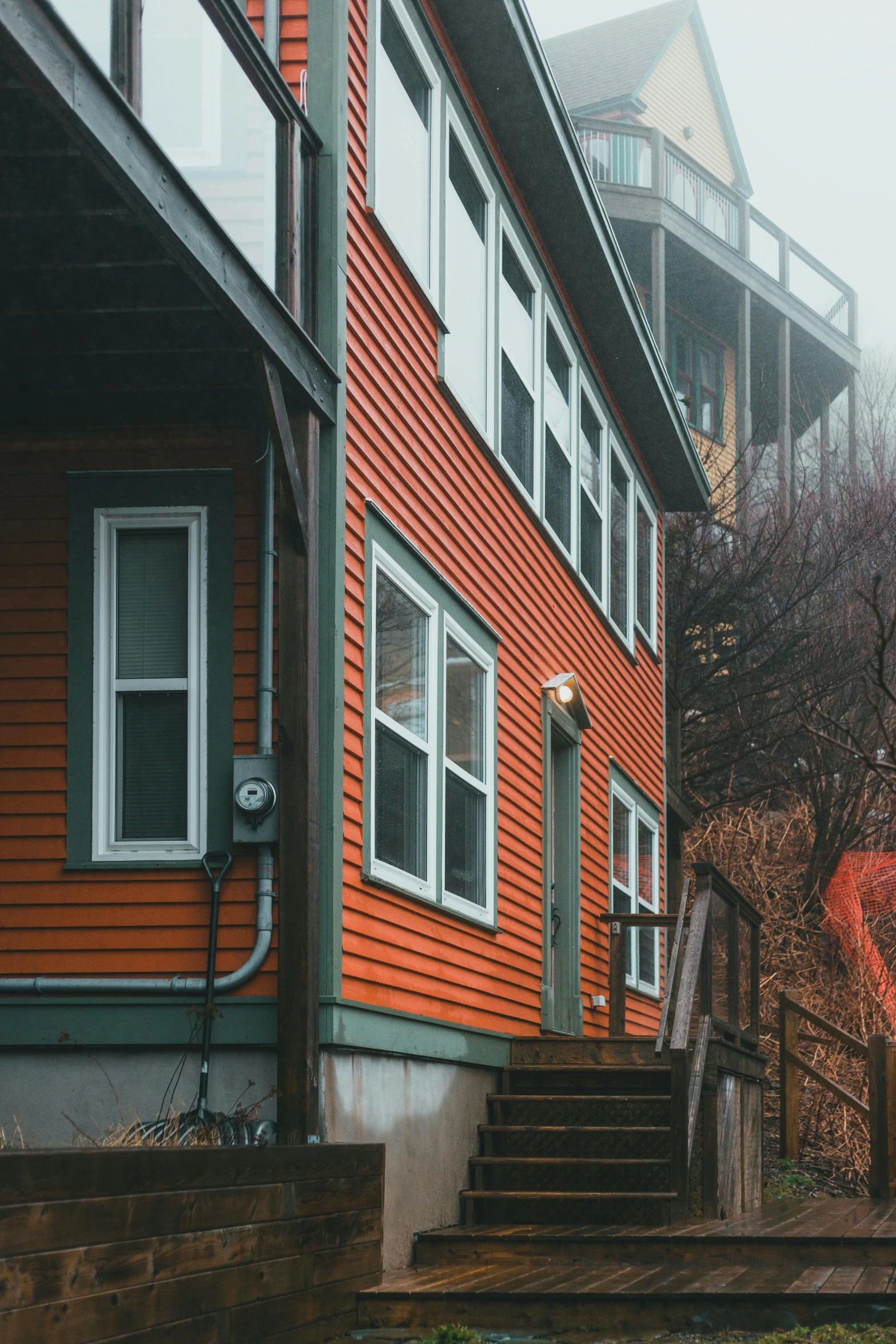 an orange house with stairs leading up to it