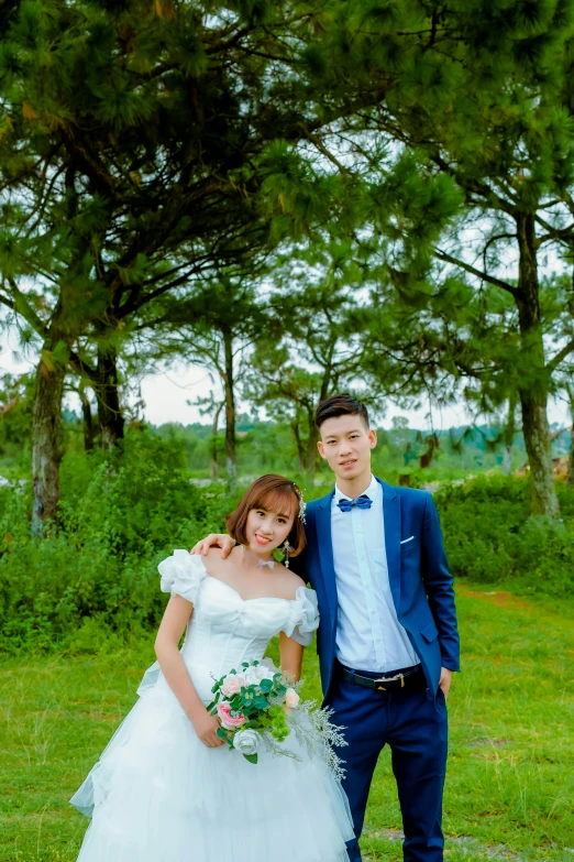young couple in formal attire standing outside