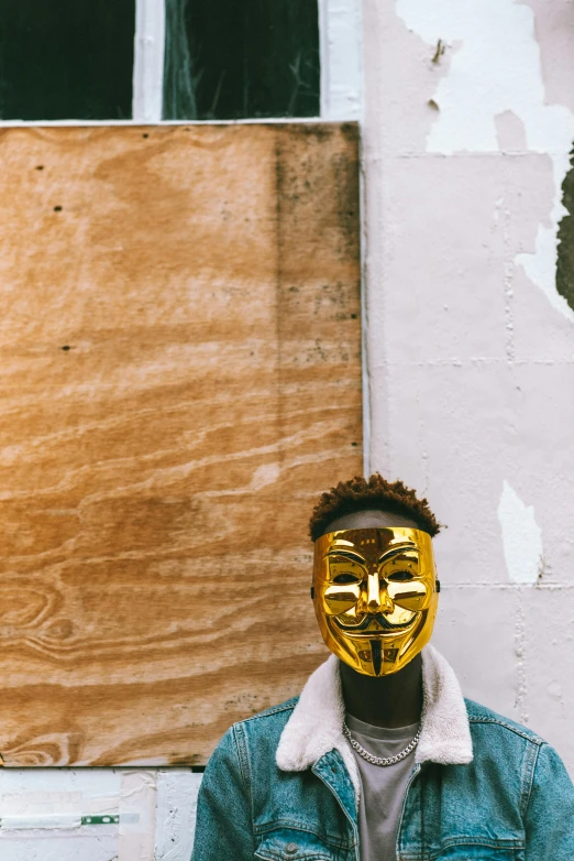 a person with a yellow mask on