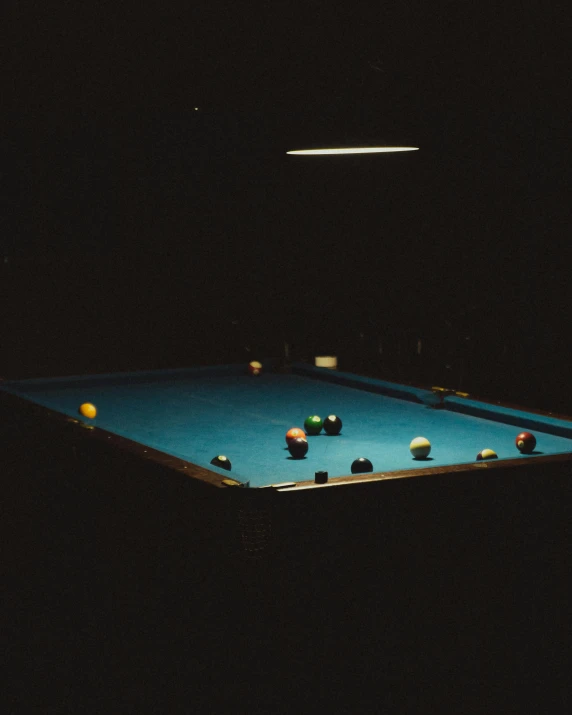 an illuminated pool table in the middle of a room