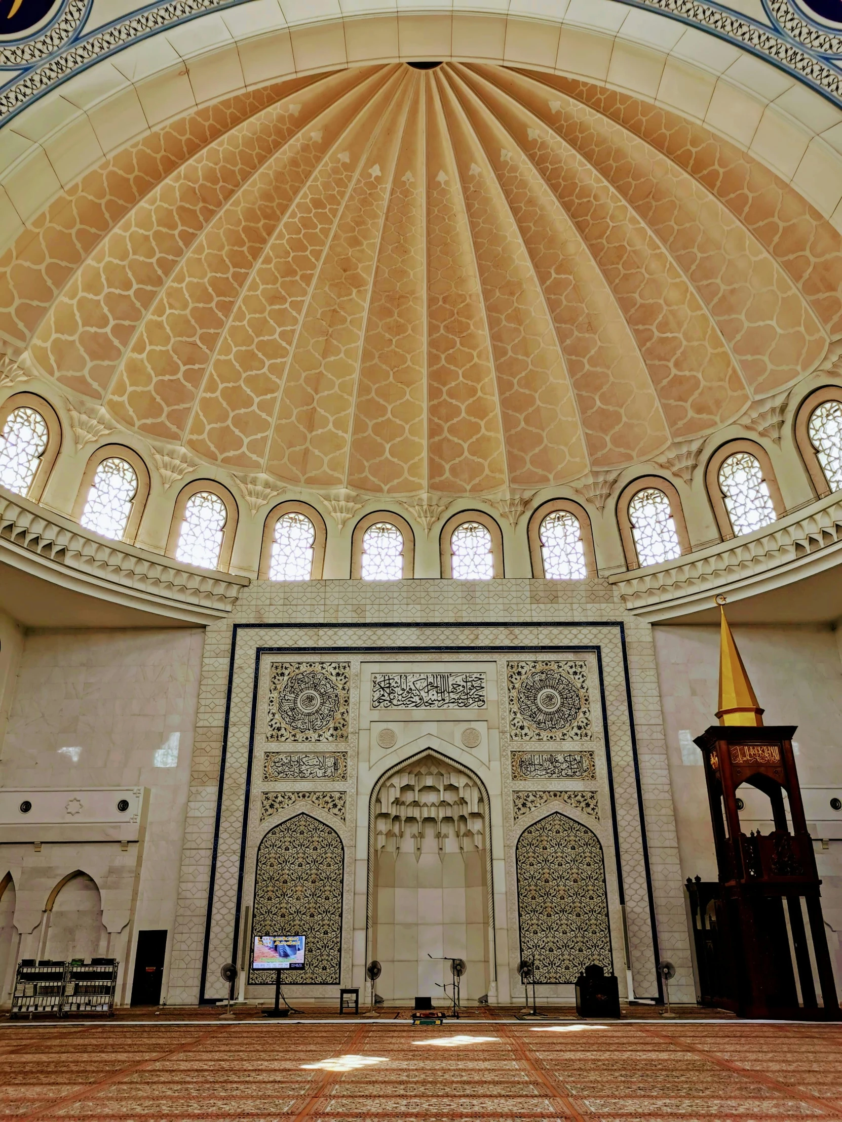 a large white room with arched doorways and windows