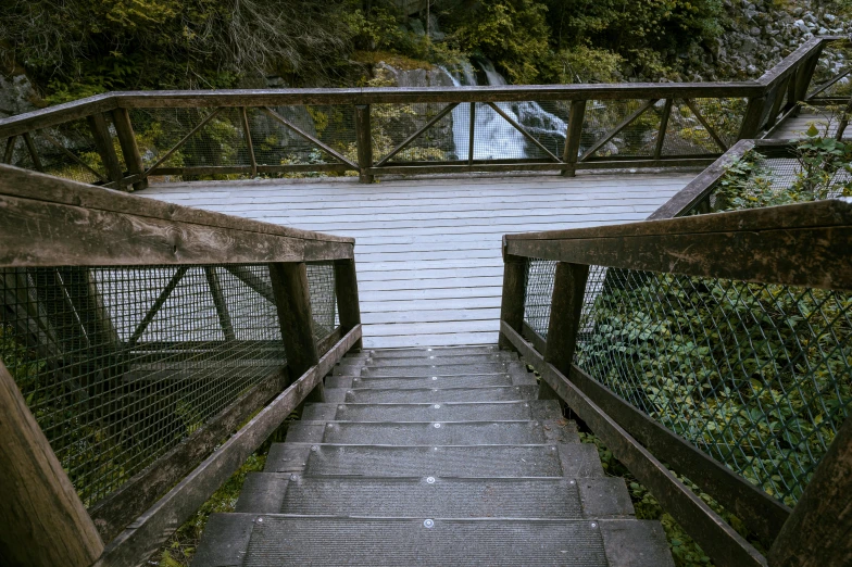 the stairs lead up to the dam where the water is running