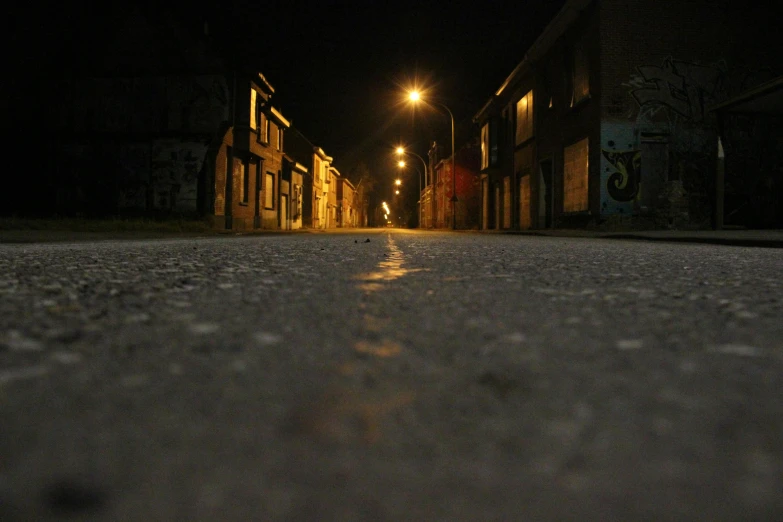 the person is walking along the street alone