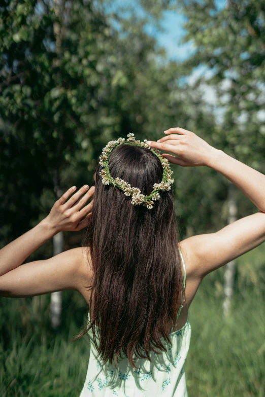 a girl has her hair done in an ancient style crown