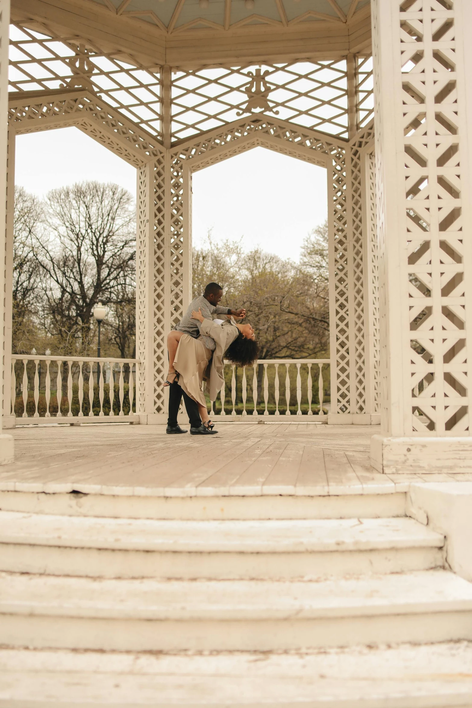 a person standing in front of a gazebo with their back to the camera