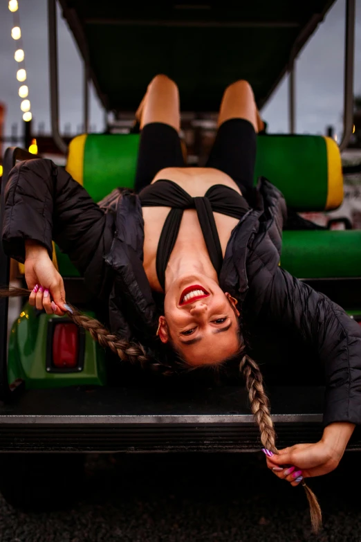 a woman is laying upside down on the ground