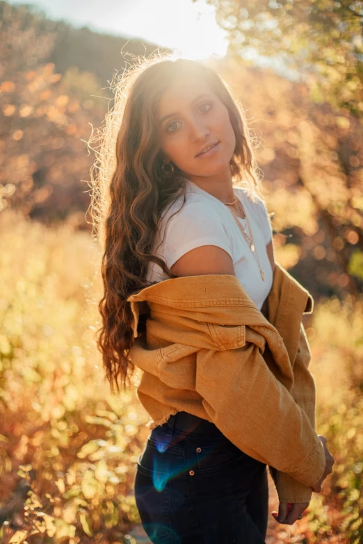 a girl posing for a picture while outside