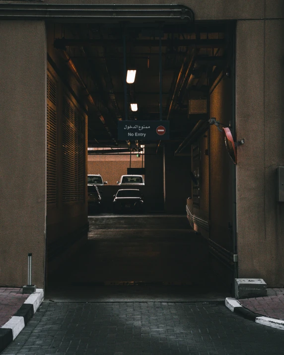 cars are parked in the dark in an open area