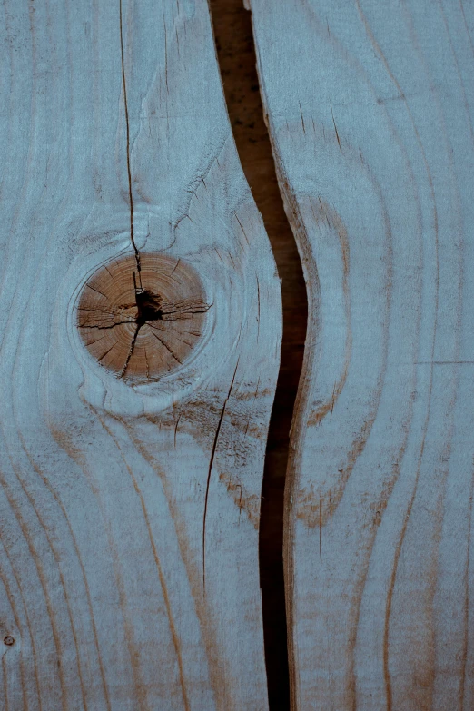 a blue wooden surface with a hole cut in the center