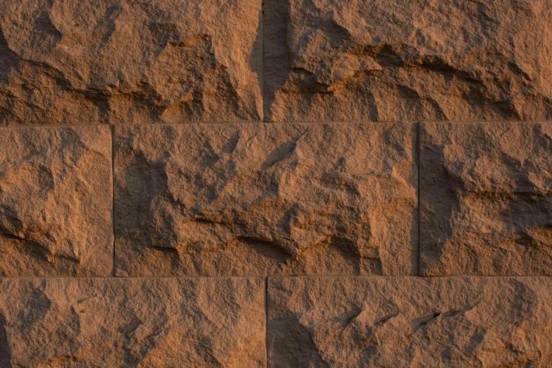 an image of some sand with some rocks