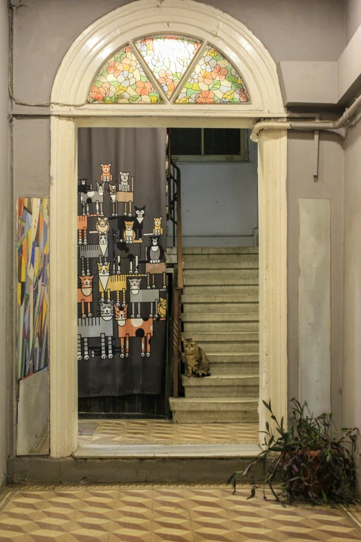 a room with an elaborate staircase and a decorated window