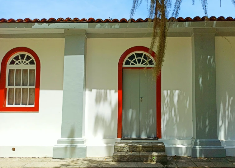 two identical doors on two different buildings near one another