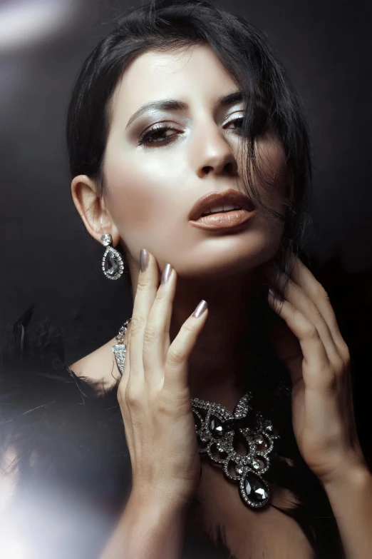 a woman is wearing some jewelry and posing