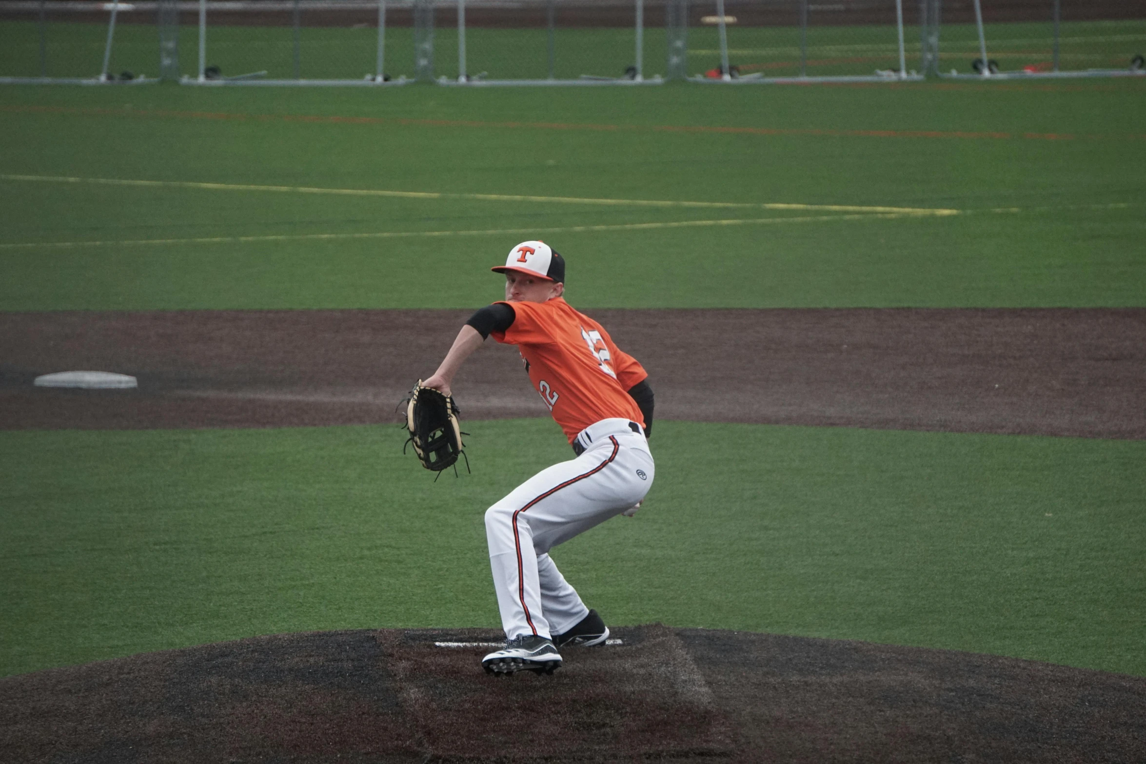 the man is preparing to pitch the ball