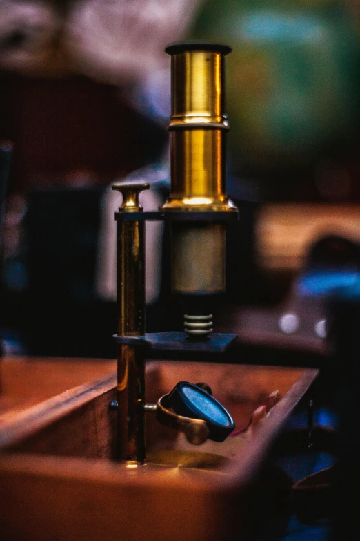 a ss flask and two similar sized cups on a wooden table