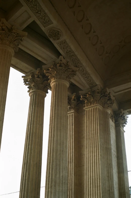 three decorative pillars against the building wall