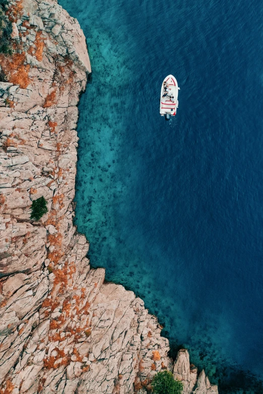 a boat floating on top of a large body of water