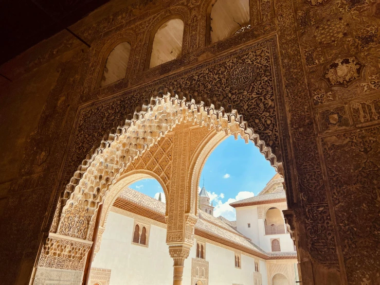 the inside view of a stone building with a large arch in it