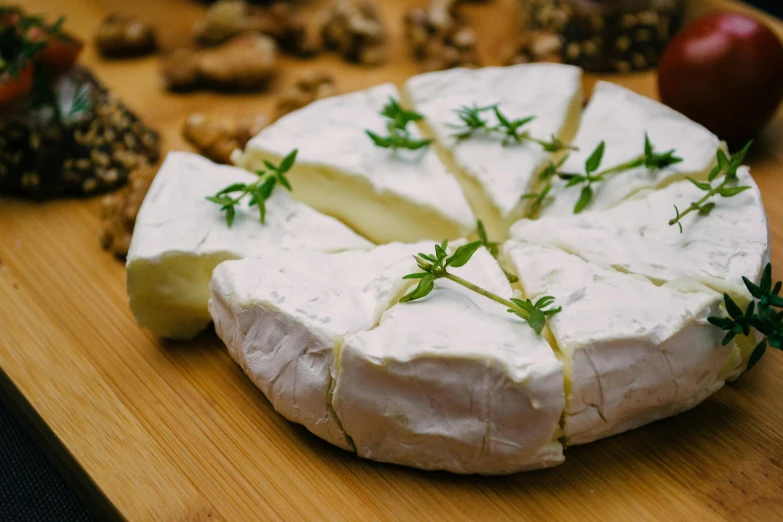 a wheel of camembere topped with rosemary