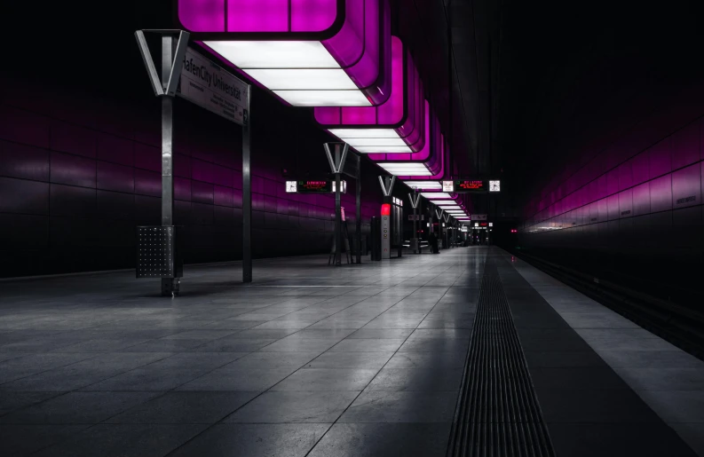 purple light shining down the ceiling in a tunnel