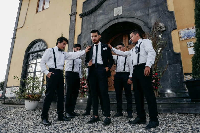 several men who are all dressed up standing together