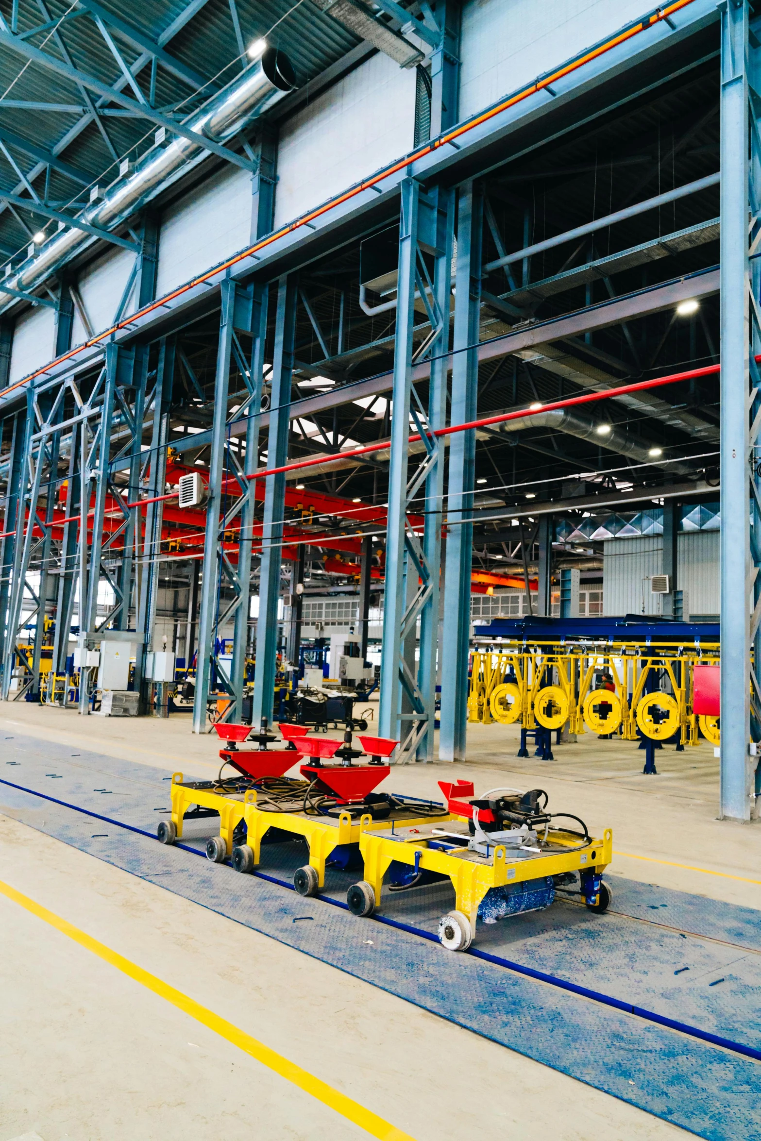 a factory filled with lots of large yellow equipment