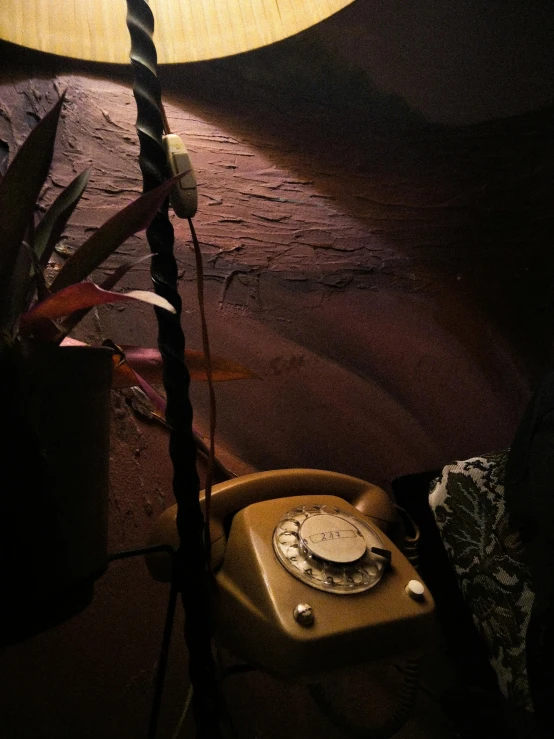 an old fashioned telephone on a wooden table