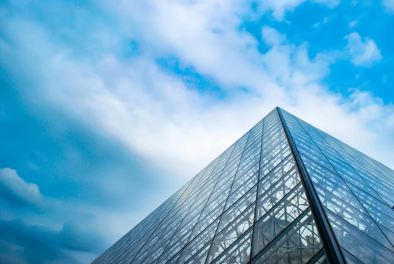 a building with a very tall glass pyramid