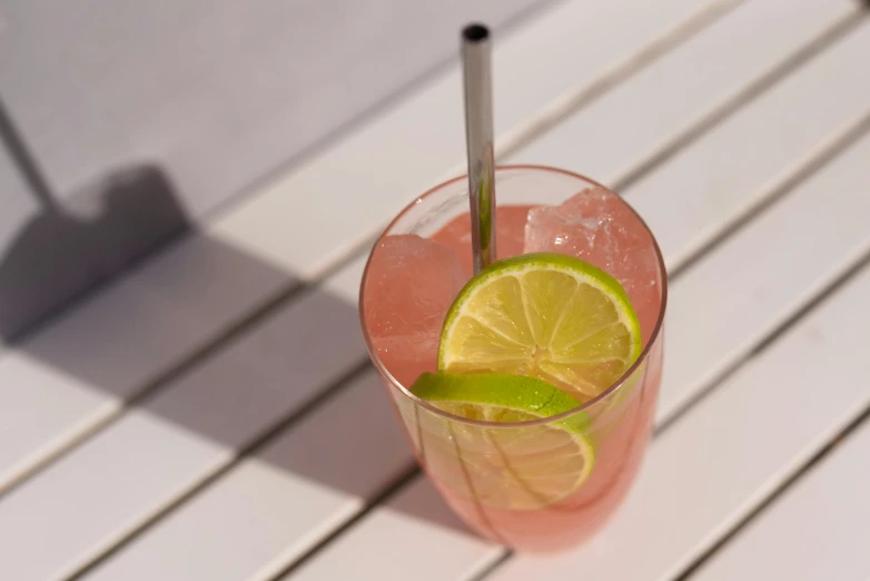 a drink on a table with two straws